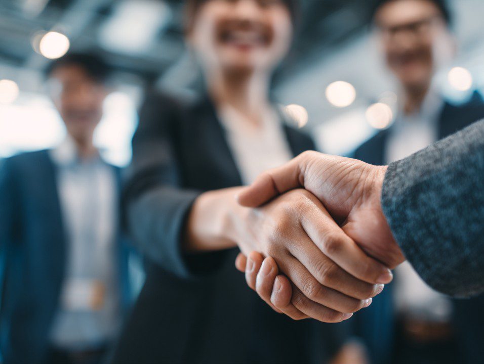 Business partnership handshake
